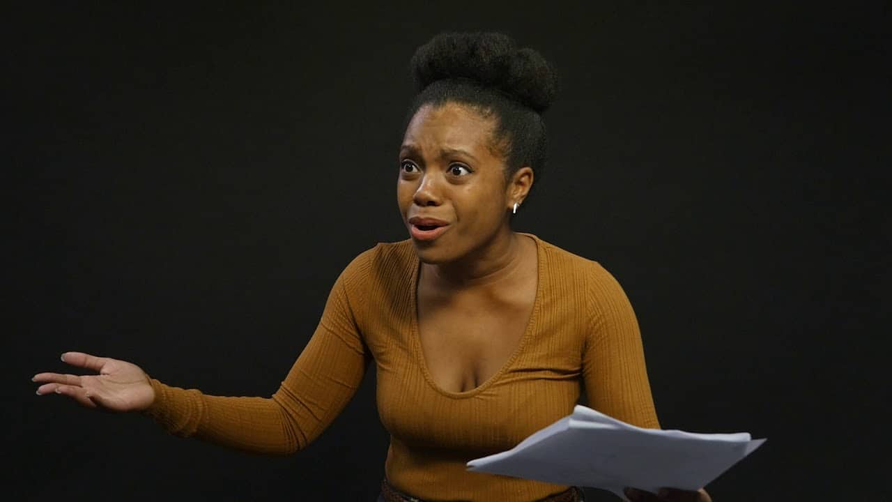 Sakile Lyles during a rehearsal with script during summer acting program