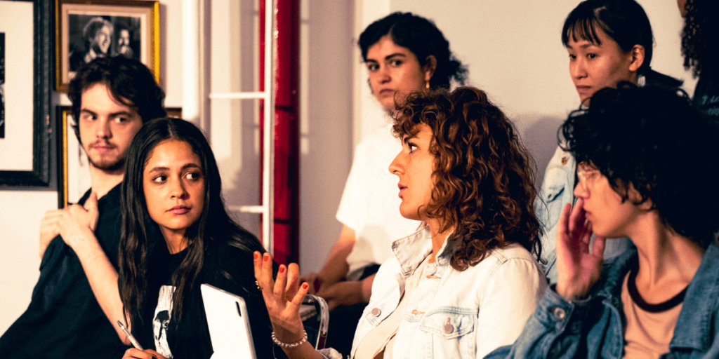 A photo showing actors practicing the Meisner acting technique in a classroom setting