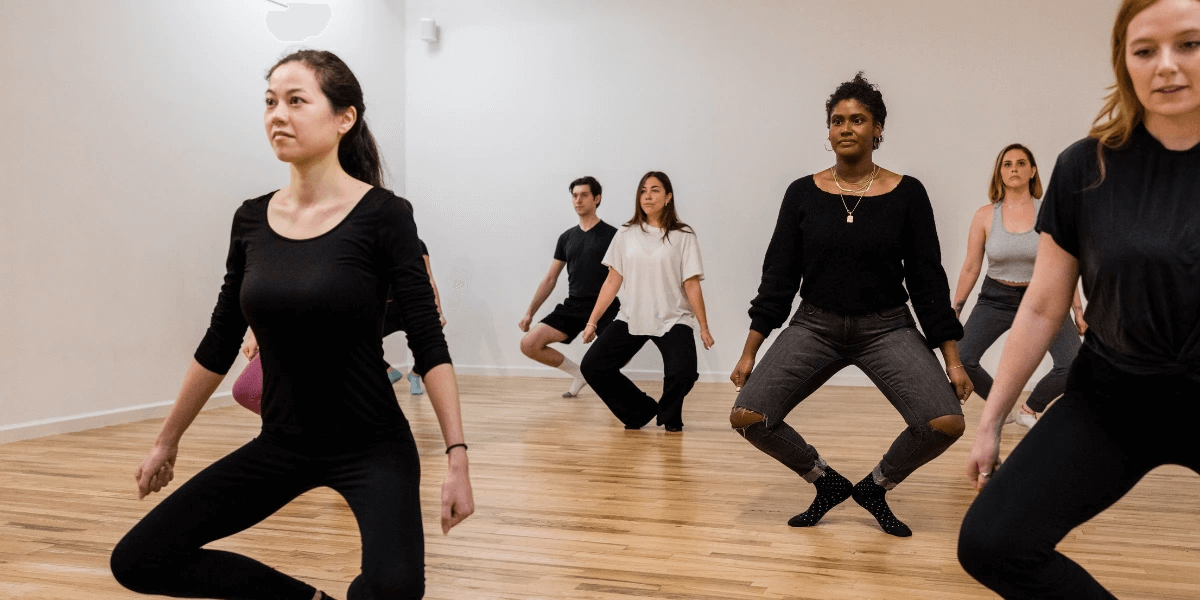 Actors in a professional acting class, learning proper movement