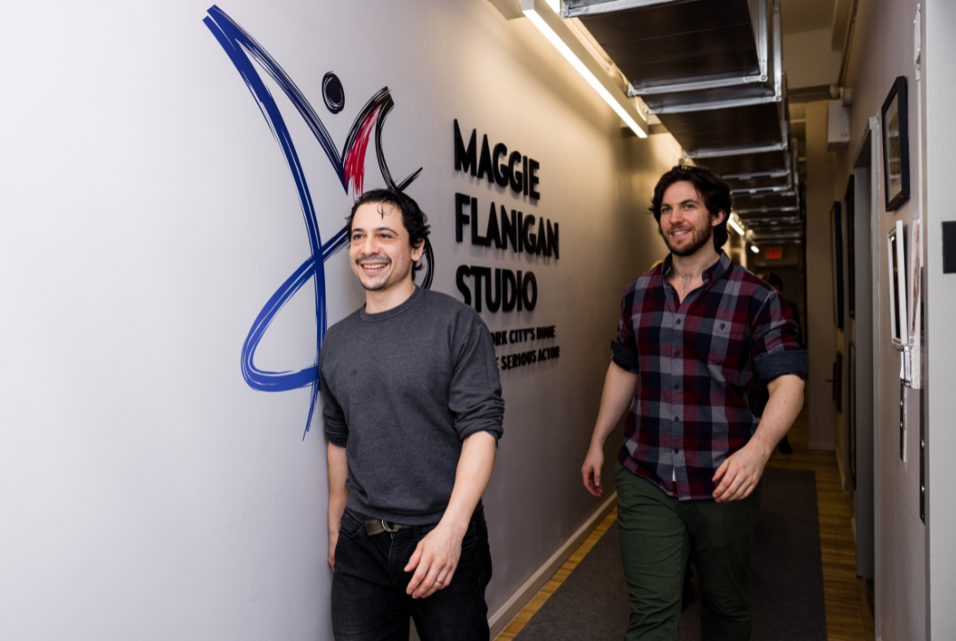 Two actors walking through the corridors of the Maggie Flanigan Studio