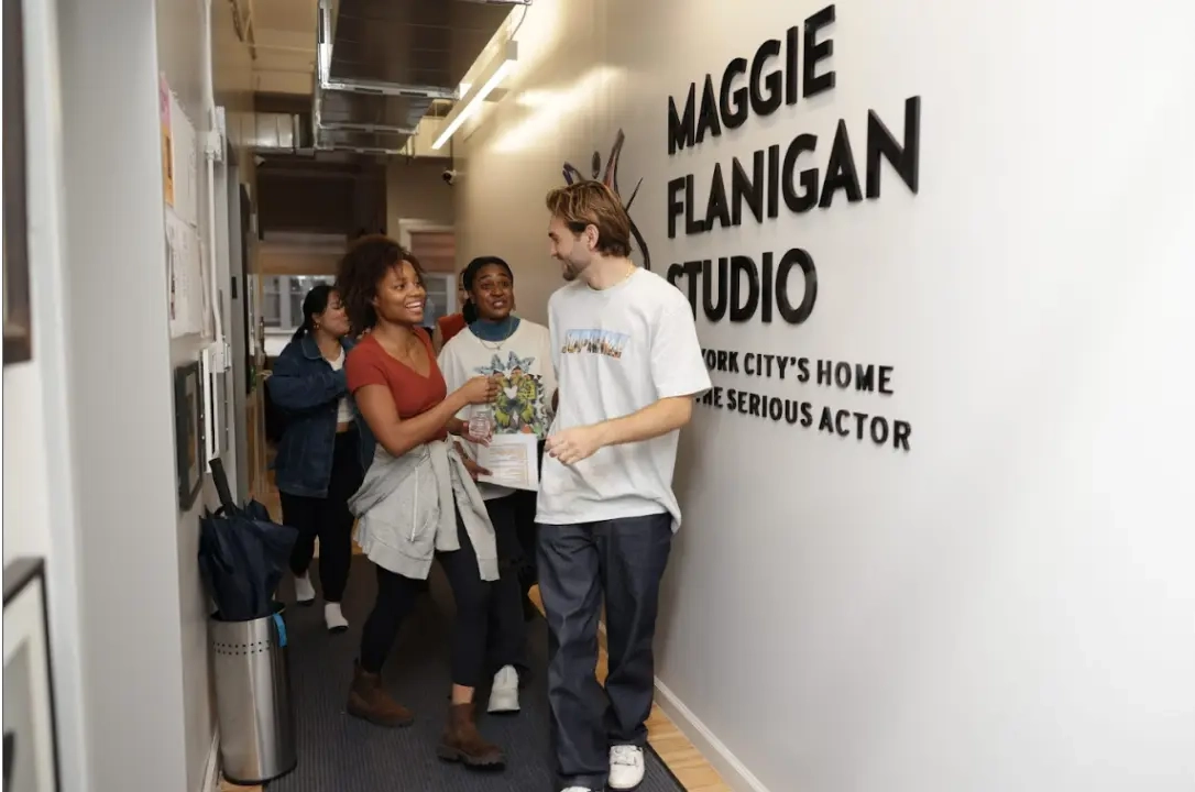 A corridor showing the name 'Maggie Flanigan Studio' on the wall.