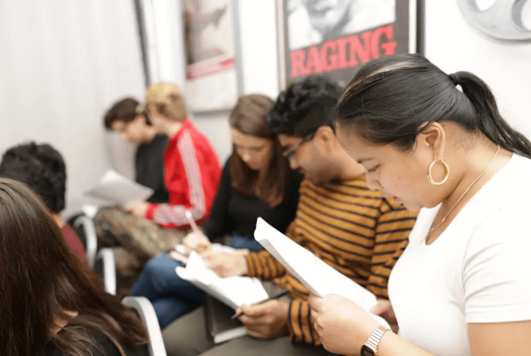 Students at Maggie Flanigan Studio studying their scripts.